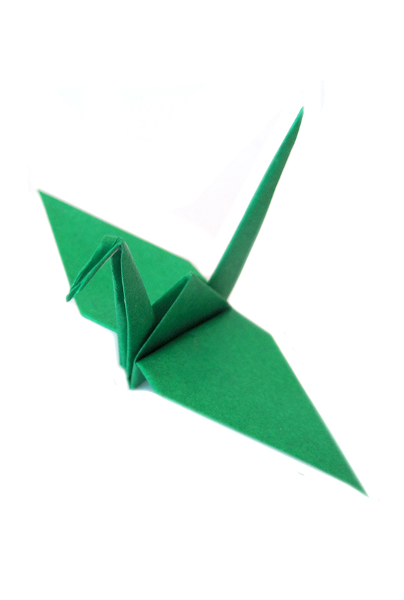 green paper origami crane